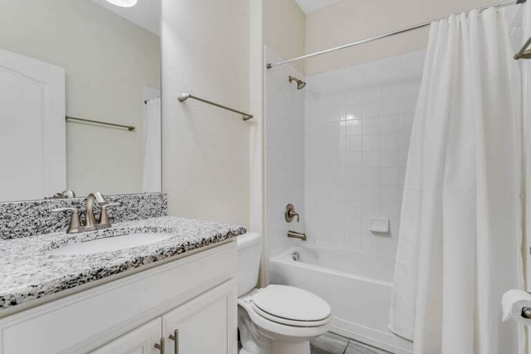 Bathroom with tub and shower combo