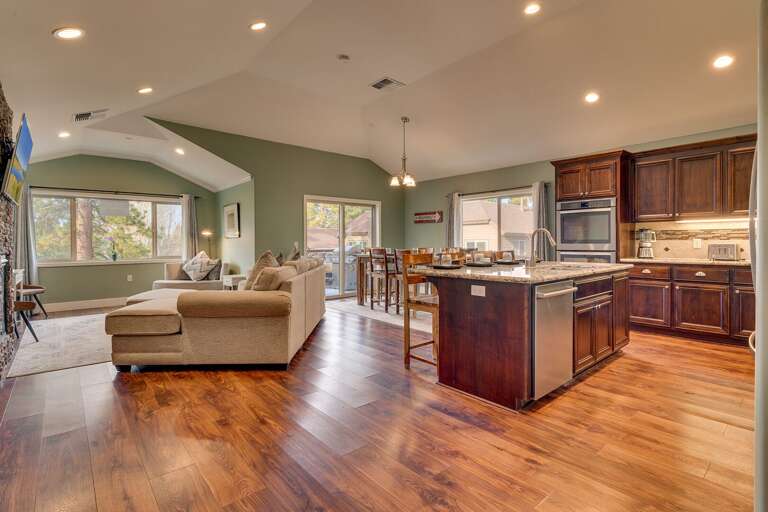 Kitchen area with large island and granite counter tops