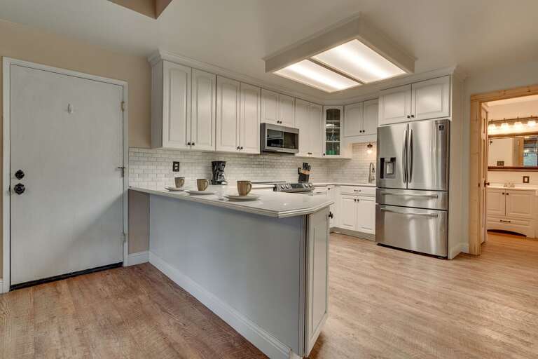 Kitchen area with stainless-steel appliance