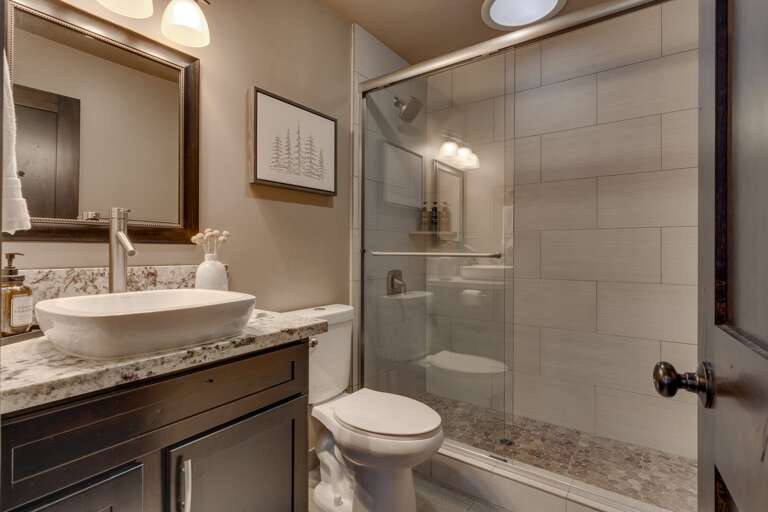 Bathroom with glass enclosed shower