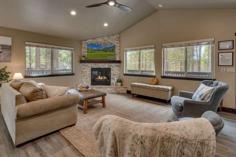 Living area with sectional sofa, flat screen TV and fireplace