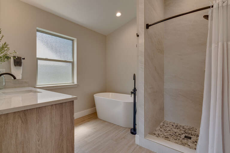 Bathroom w/ Dual Sinks, Jetted Tub, and Shower