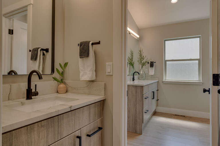 Bathroom w/ Dual Sinks, Jetted Tub, and Shower