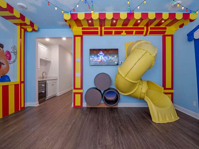 Andy's room themed bedroom with dual Full beds, fun slide, and arcades Andy's room themed bedroom with dual Full beds, fun slide, and arcades