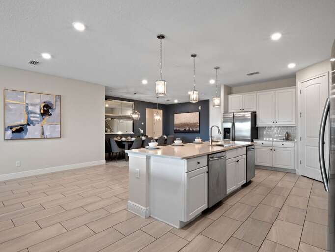 Kitchen area with stainless steel appliances and spacious island Kitchen area with stainless steel appliances and spacious island