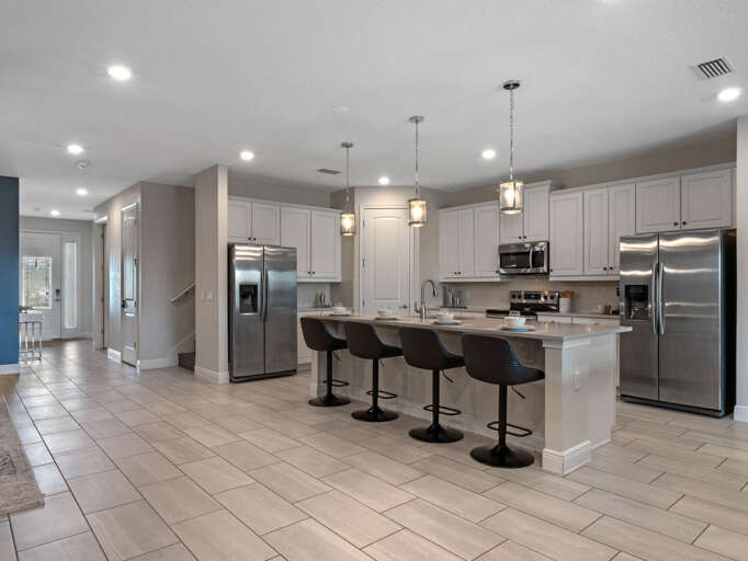 Kitchen area with stainless steel appliances and spacious island Kitchen area with stainless steel appliances and spacious island