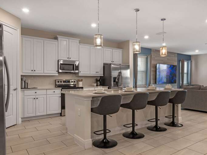 Kitchen area with stainless steel appliances and spacious island Kitchen area with stainless steel appliances and spacious island