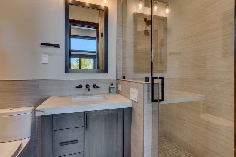 Bathroom with glass enclosed shower