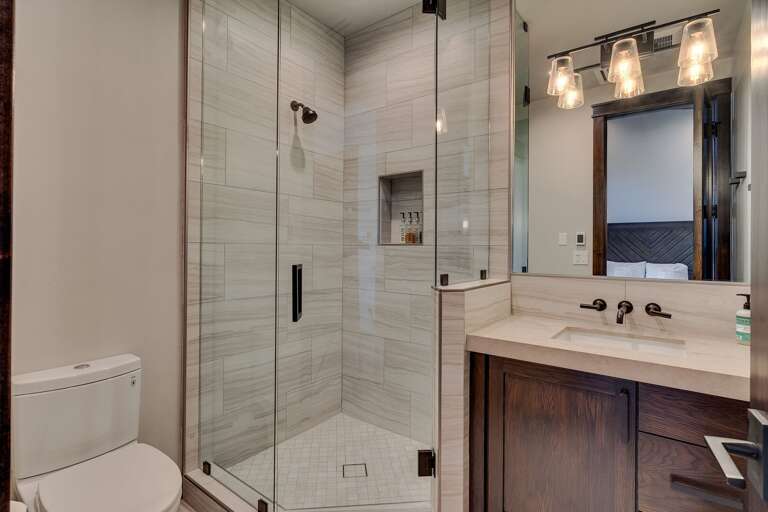 Bathroom with glass enclosed shower
