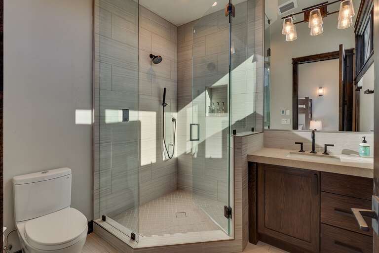 Bathroom with glass enclosed shower