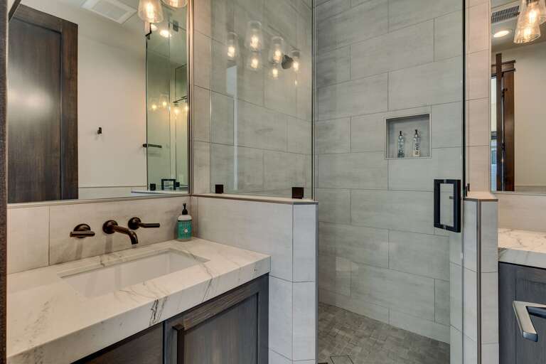 Bathroom with glass enclosed shower