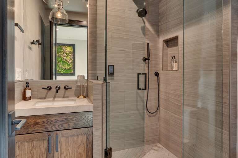 Bathroom with glass enclosed shower