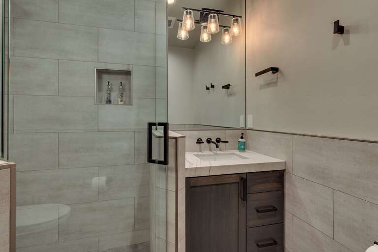 Bathroom with glass enclosed shower