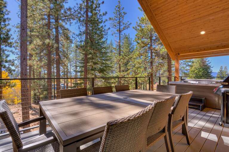 Deck with seating area and hot tub