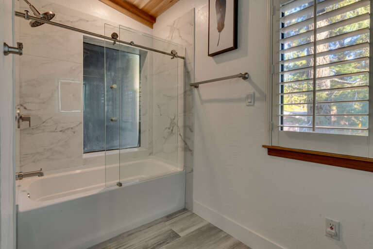 Bathroom with tub and shower combo