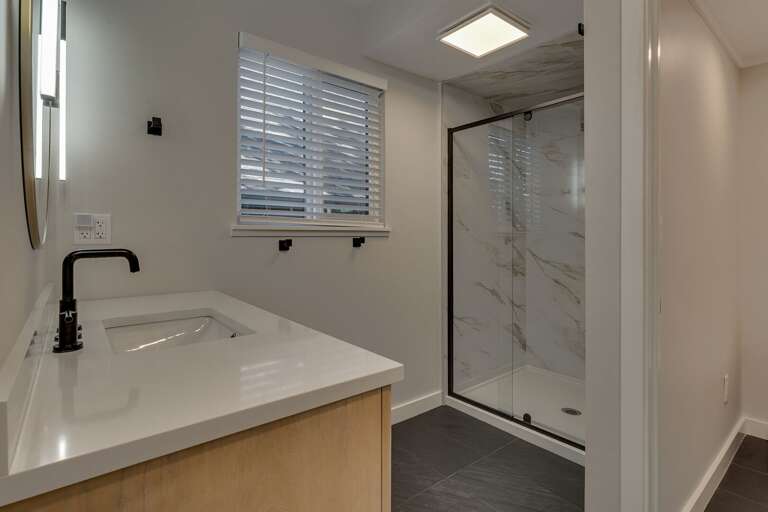Bathroom with glass enclosed shower