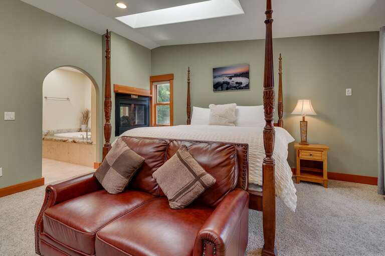- Master king suite with four-poster bed and lounge seating
- Cozy fireplace and spa-style ensuite bathroom
- Tahoe retreat with warm finishes and natural light