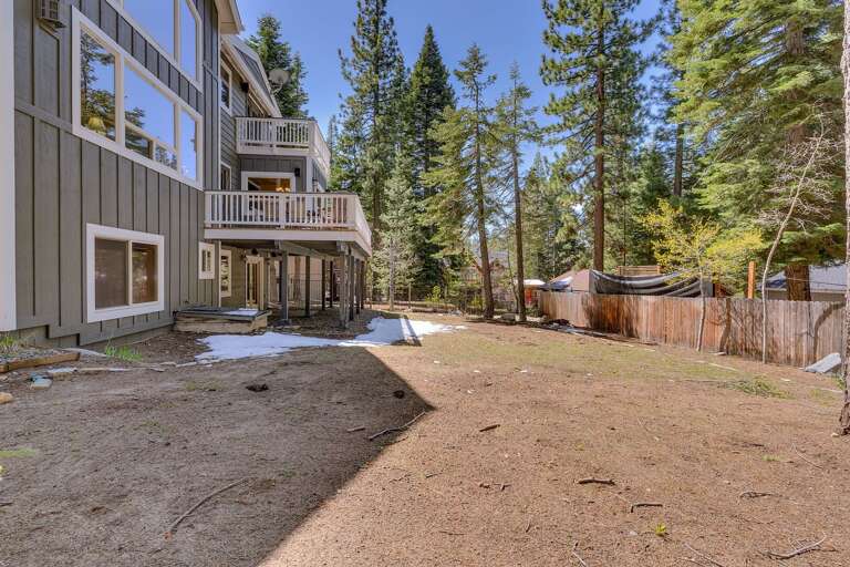 - Multi-level decks overlooking the backyard
- Large outdoor space ideal for group stays
- Relax in a serene mountain setting