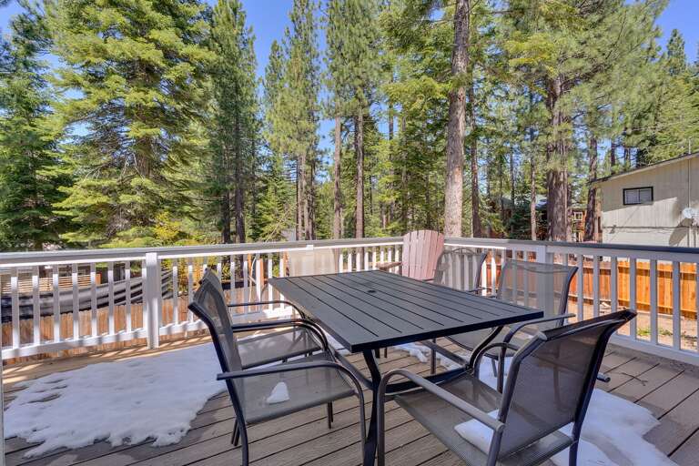 - Outdoor deck with dining table and forest views
- Peaceful Tahoe setting surrounded by towering pines
- Perfect space for morning coffee or evening meals outdoors