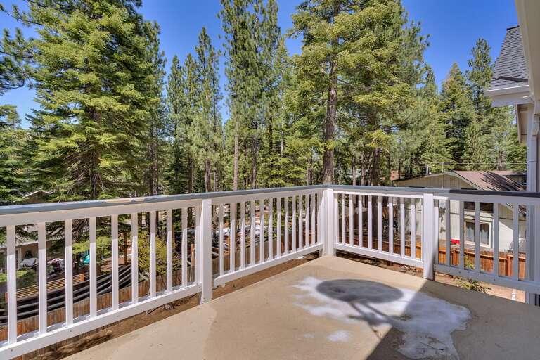 - Private deck access from the master suite
- Peaceful outdoor space surrounded by towering pines
- Relaxing forest views