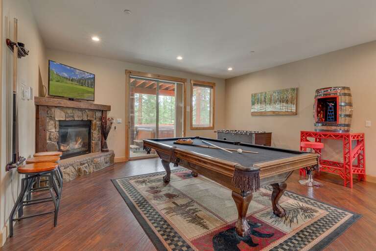 Game room w/ pool table, arcade, and foosball