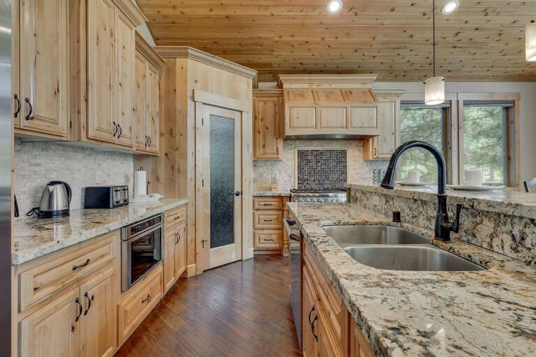 Kitchen area w/ stainless steel appliance