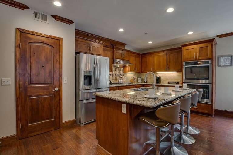 Kitchen Area w/ Stainless-steel Appliances and Spacious Island