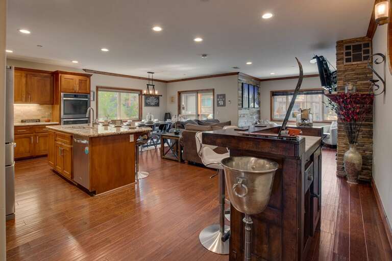 Living, Kitchen, Dining Area, and Freestanding Rustic Bar