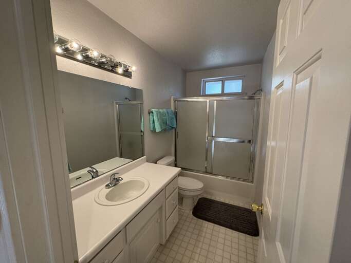 Bathroom with glass enclosed shower
