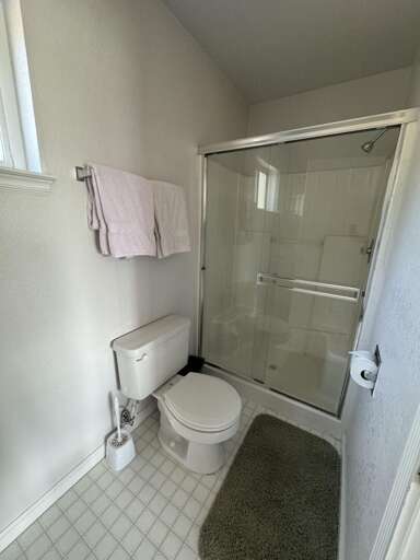 Bathroom with glass enclosed shower