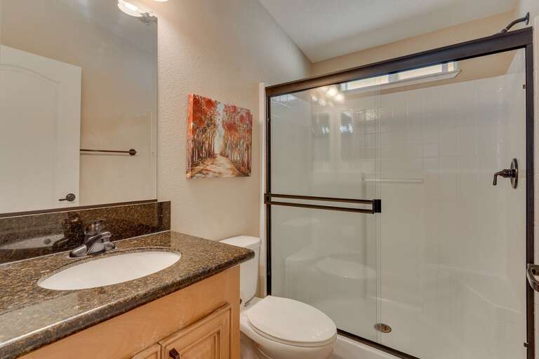 Bathroom with glass enclosed shower