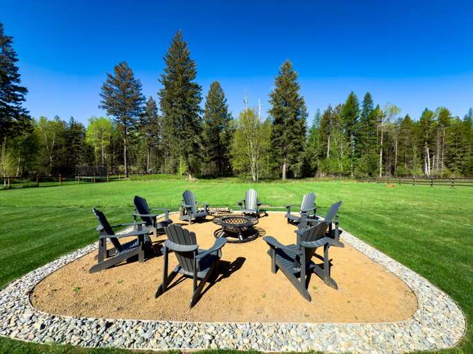 Chairs Circled On Sandy Spot, Scenic Spruce Setting