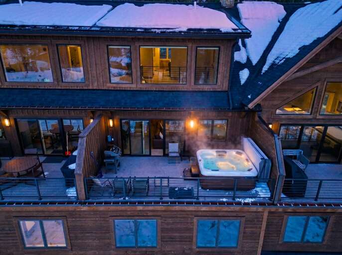 Snowy Deck With Steaming Hot Tub