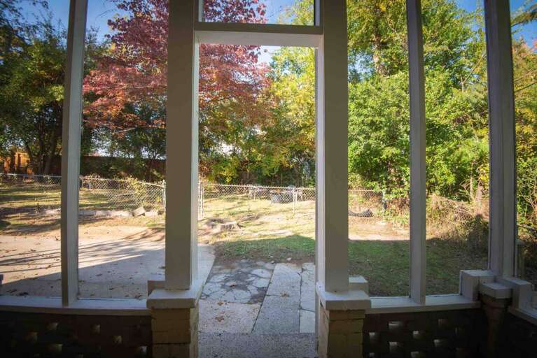 The porch faces the fenced in yard where dogs and humans alike can play  The porch faces the fenced in yard where dogs and humans alike can play