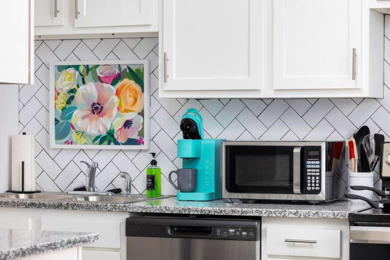Kitchen equipped with Keurig, microwave, and dish soap. Kitchen equipped with Keurig, microwave, and dish soap.
