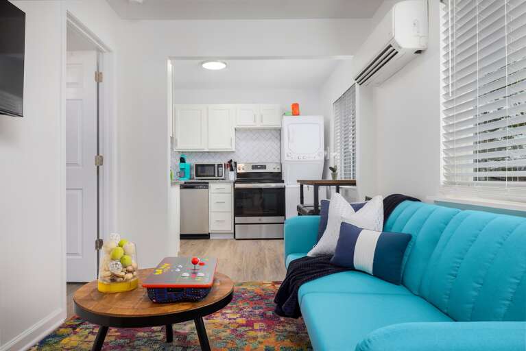 Living room with view into the kitchen. Living room with view into the kitchen.