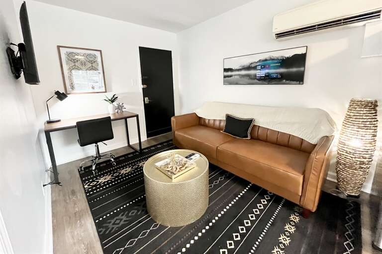 Neutral living space to relax and watch all of your favorite shows