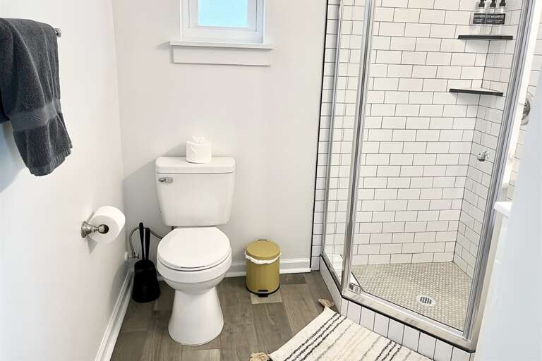 Bathroom with walk in shower and toiletries 