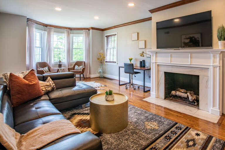 Cozy couch with lots of pillows and throw blankets