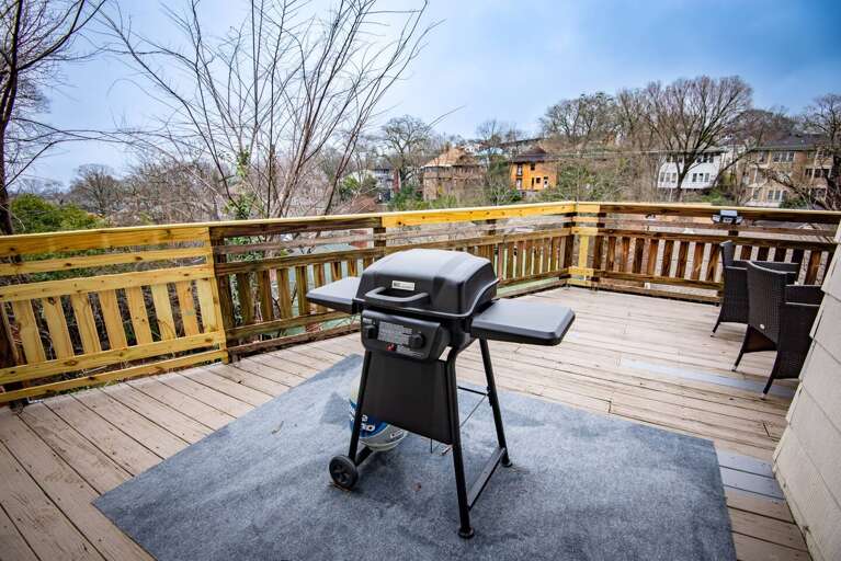 [Back deck] BBQ gas grill &amp; outdoor lounging area with plenty of seating. 