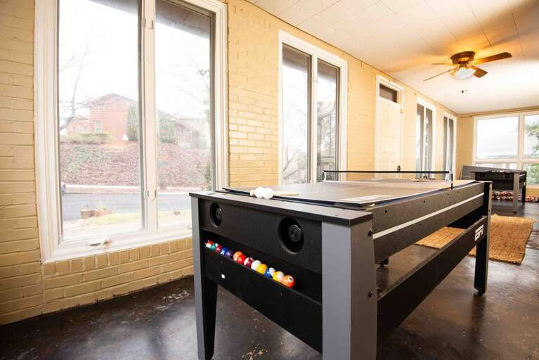 [Sun room] Spacious sun room doubles as a game room with pool table &amp; ping pong!