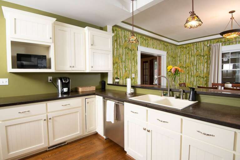 [Kitchen] Fully stocked &amp; equipped kitchen with updated appliances. Dishwasher &amp; large farmhouse sink for easy clean up. 