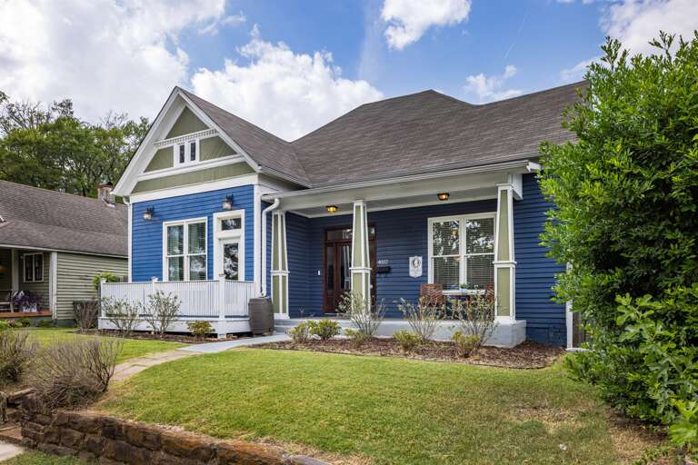 Its eye-catching blue facade stands out, exuding a sense of personality and character. This unique exterior hints at the inviting and stylish space you'll discover inside. Your journey begins at our distinctive blue house - your home away from home.
