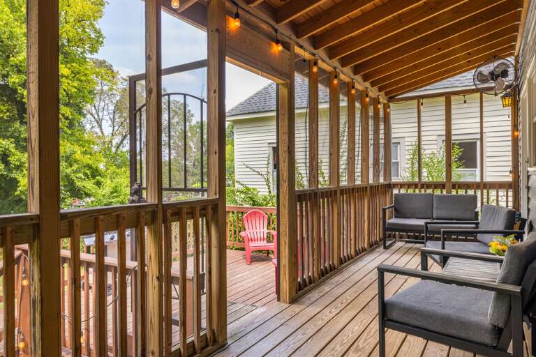Unwind in style on the expansive screened-in porch, furnished with comfortable outdoor seating that invites you to relax and enjoy the great outdoors while staying cozy.