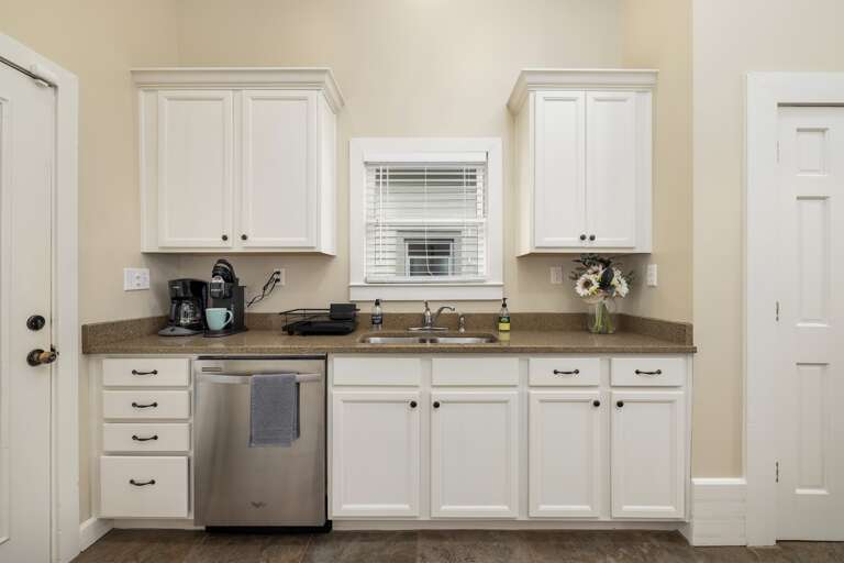 The kitchen comes fully equipped with a convenient coffee machine and Keurig to kickstart your mornings and a dishwasher to make cleanup a breeze after enjoying your meals.