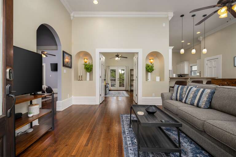 Step into our welcoming home, where comfort and entertainment await. The entryway greets you with a cozy couch and a TV, inviting you to unwind and enjoy your stay from the moment you arrive. Your relaxation begins here!