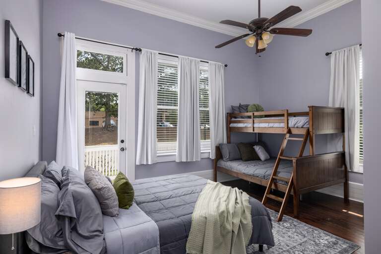 Rest comfortably in this spacious bedroom at your home, thoughtfully furnished with three beds to accommodate a variety of sleeping arrangements for your group's convenience.