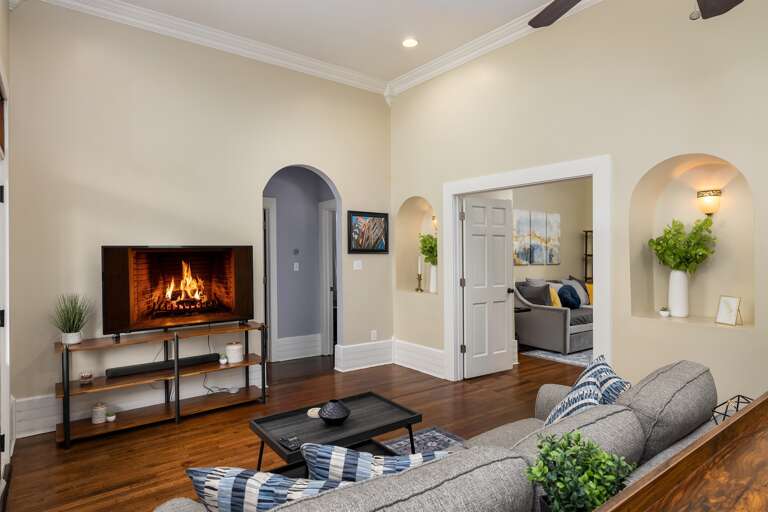 Well-lit living room: Sun-drenched and welcoming, this room is flooded with natural light, creating a bright and airy atmosphere that's perfect for relaxation or gatherings.