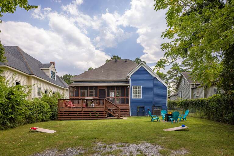 Step into the serene beauty of your home's large, lush green backyard, a peaceful retreat where you can relax and connect with nature during your stay.