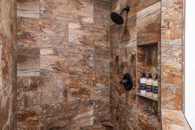 Step into the convenience of a walk-in shower, complete with complimentary shampoo, conditioner, and body wash, making your daily routine a breeze during your stay.